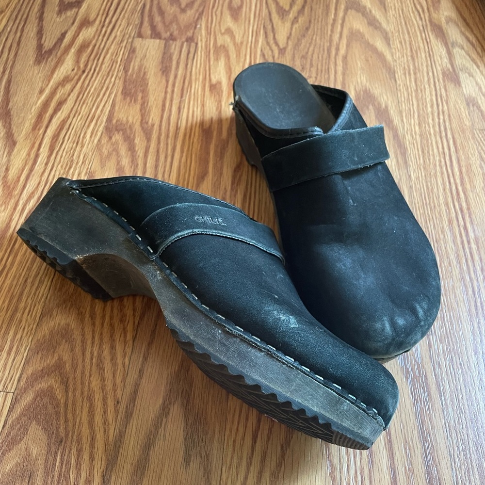 Black suede wooden heel mules by Chili’s